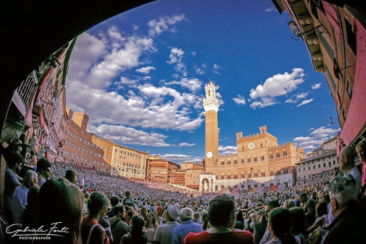 A festival atmosphere in the Piazza del Campo, Siena, Italy © Gabriele Forti